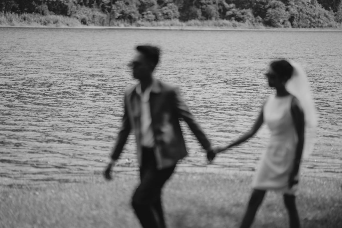 Nigel and Mary running toward each other among the trees